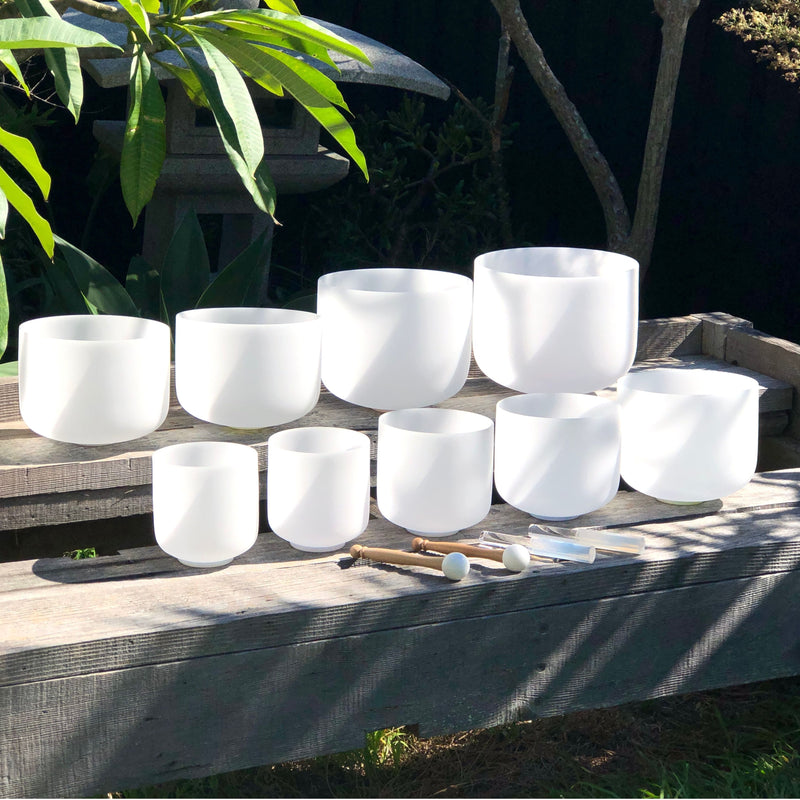 Set of 9 White Crystal Singing Bowls in Beige Bags