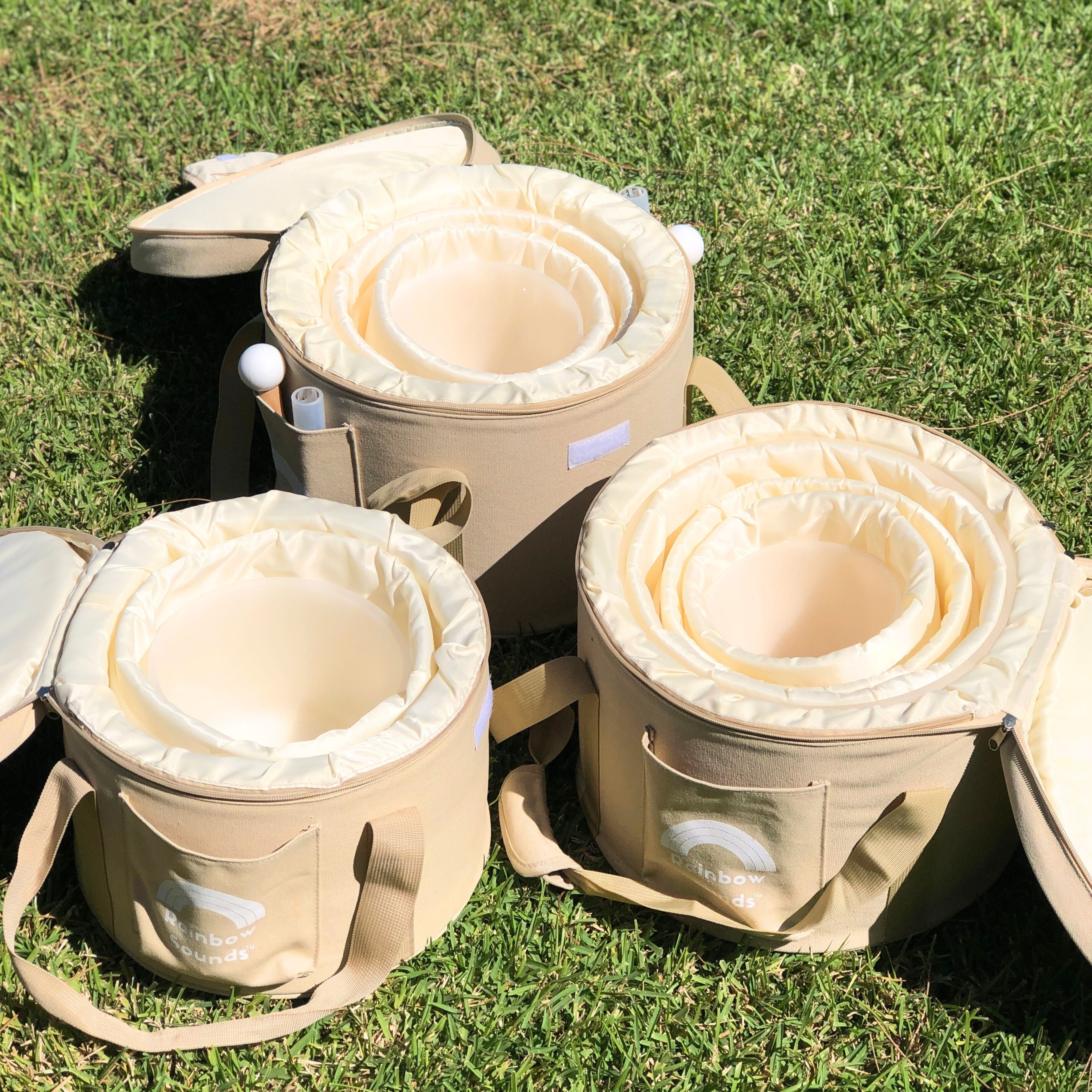 Set of 9 White Crystal Singing Bowls in Beige Bags